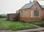 Our Village Hall circa 1990

- with thermometer showing progress

of fundraising for the new Village Hall