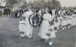 L-R

Susan Tyson, garland carried by

Doreen Raine and Fran Piercy

Carol Kightly on right

Morris Dancers in the background